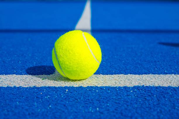 istock One ball on a blue paddle tennis court. 2202544938