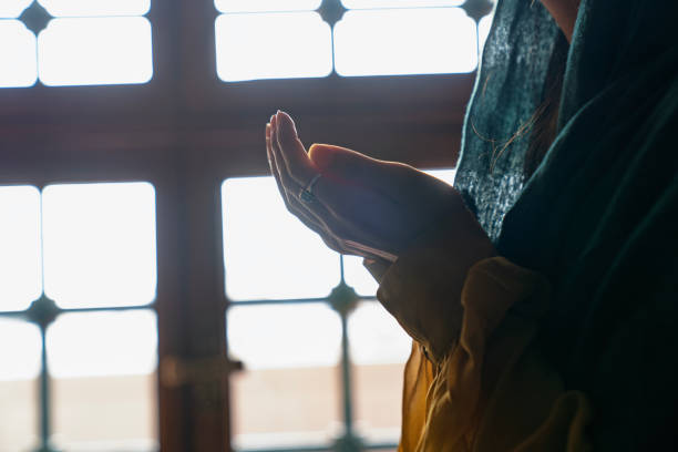 istock Young Muslim woman Praying 2202549413