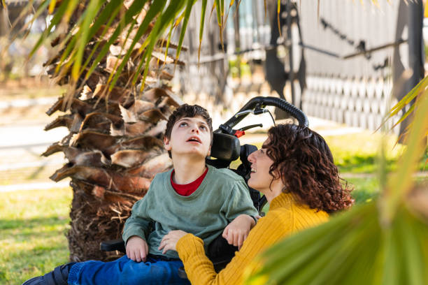 Mother and son with disability enjoying a day at the park