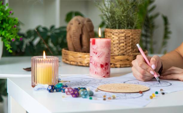 istock Woman astrologer draws a natal chart. Selective focus 2202554876