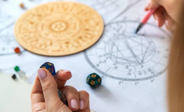 istock Woman numerologist astrologer counts numbers. Selective focus 2202554898