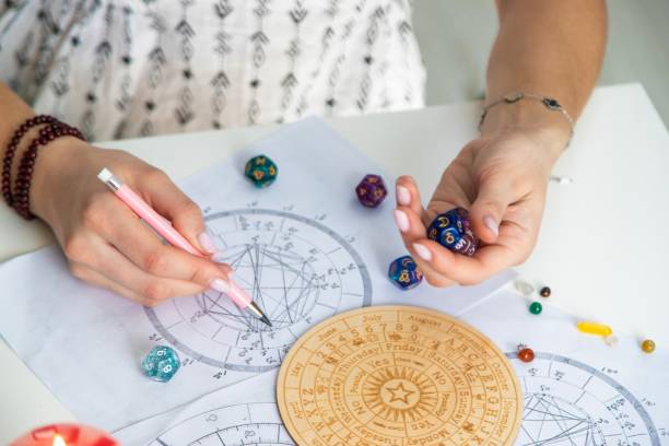 istock Woman numerologist astrologer counts numbers. Selective focus 2202554967