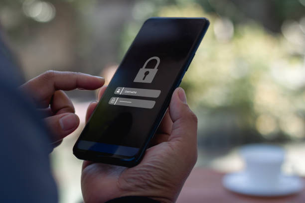 istock Cyber security concept. Hand holding a smartphone to login username password on screen. Data privacy online protection on mobile phone application with 2FA increases security. Secure internet access. 2202558019