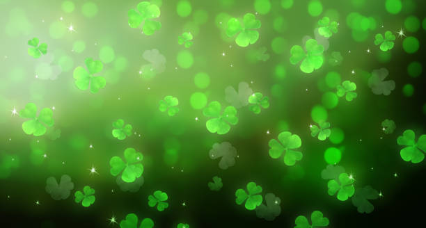 istock St. Patrick's Day green shamrock background, pattern with clover leaves, abstract holiday backdrop. 2202564689