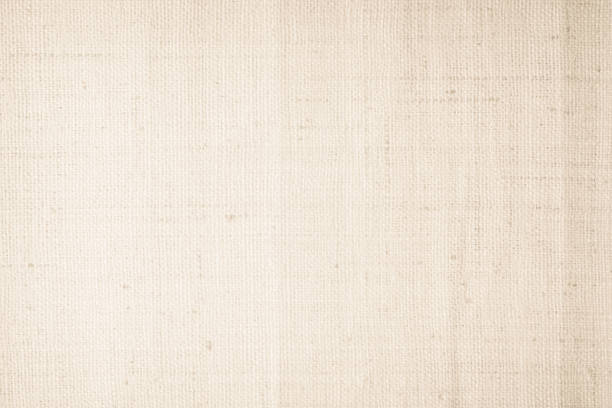 istock Brown sackcloth woven texture background in natural pattern. Jute hessian burlap, linen background in light beige cream color blank. Weaving canvas fiber line cotton cloth textured as organic. 2202573982