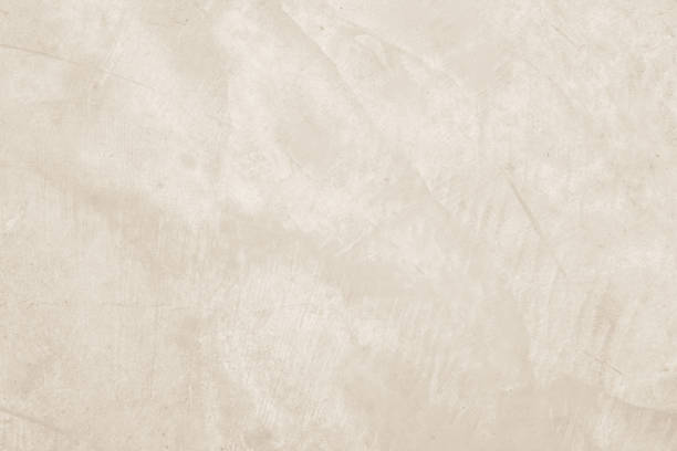 istock Colour old concrete wall texture background. Close up retro plain cream color cement wall background texture. Design paper vintage parchment element. 2202573989