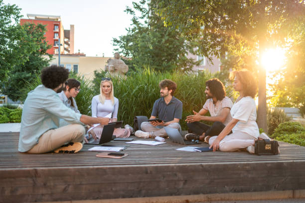 istock Diverse Executives Discussing Strategies Outdoors 2202575063