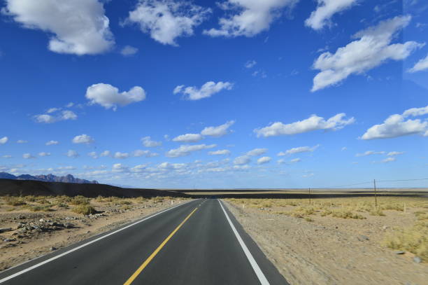 istock Desert road sand dunes in Xinjiang, China 2202580132