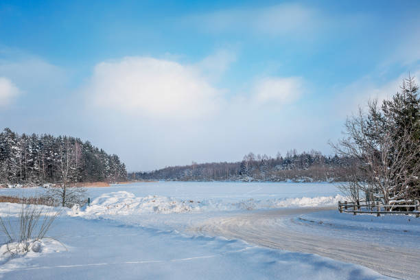 istock View to the field under snow 2202580136