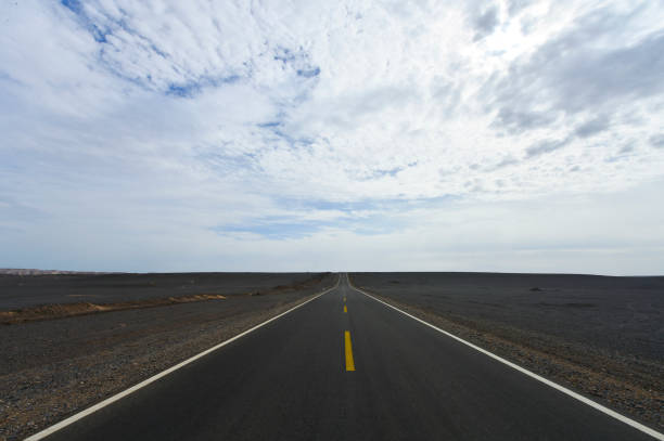 istock Desert road sand dunes in Xinjiang, China 2202580141