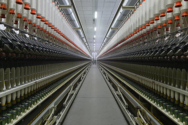 istock Cotton textile factory equipment is in operation 2202581122