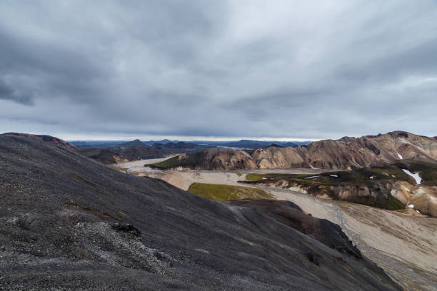 istock Breathtaking View of Rugged Icelandic Landscape Under Dramatic Cloudy Sky, Showcasing Unique Geology and Natural Beauty of Landmannalaugar Region 2202581207
