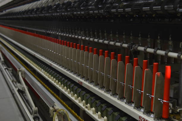 istock Cotton textile factory equipment is in operation 2202581447