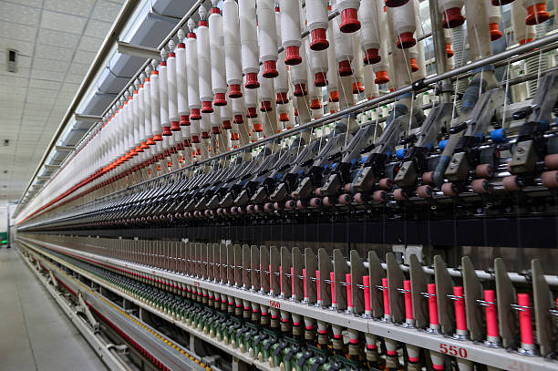 istock Cotton textile factory equipment is in operation 2202581452