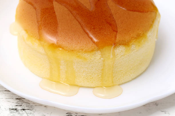 istock Homemade round sponge cake or castella cake with honey 2202583965