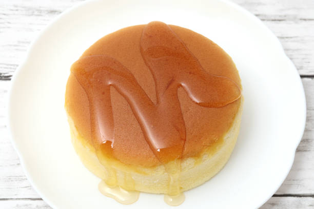 istock Homemade round castella cake or sponge cake with honey 2202583982