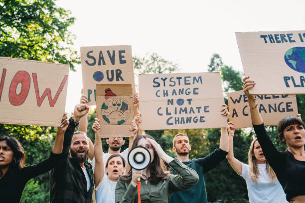 istock A group of climate activists are marching together in a demonstration against climate change 2202587301