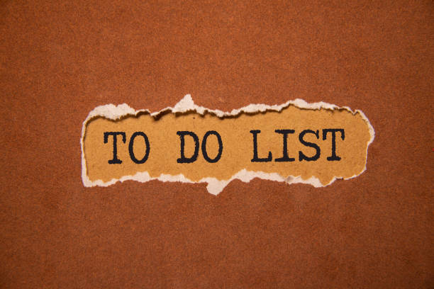 Hand with marker writing: To Do List: So Many Things