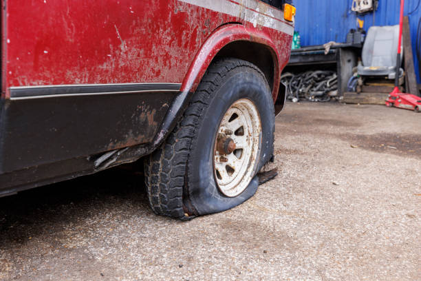 istock Flat Tire Woes: Old Truck's Roadside Misfortune 2202588960