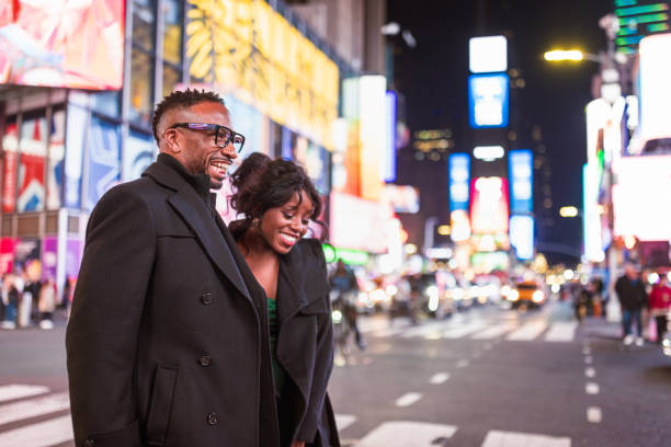 istock Elegant Couple in Times Square at Night 2202589048