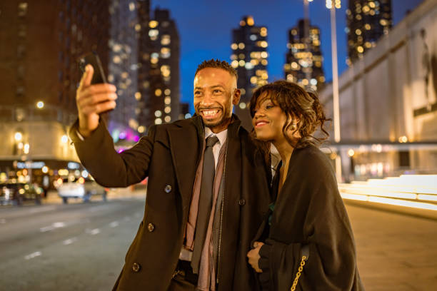 istock Elegant Couple at Times Square Night 2202589050