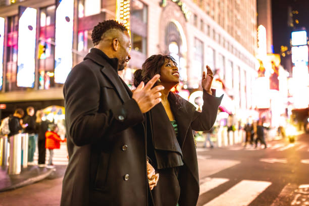 istock Elegantly Dressed Couple at Times Square, Evening, Manhattan 2202589059