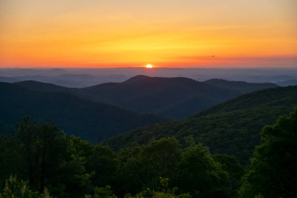 istock Sun Rises Over Horizon Behind Shenandoah Mountains 2202593096