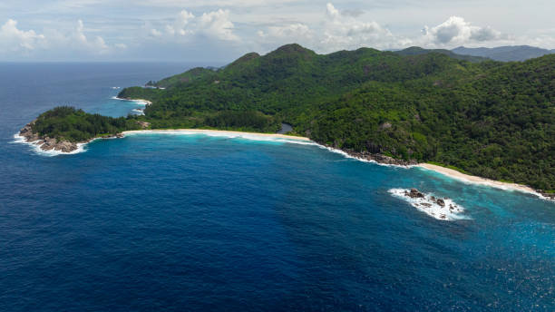 istock Pristine coastline with rainforest and rocky outcrops in Seychelles, Mahe. 2202599367