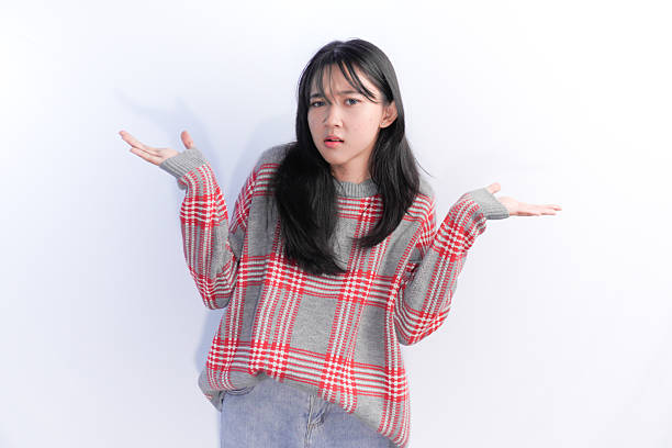 istock Asian Indonesian woman wearing red checkered sweater with clueless expression 2202606448