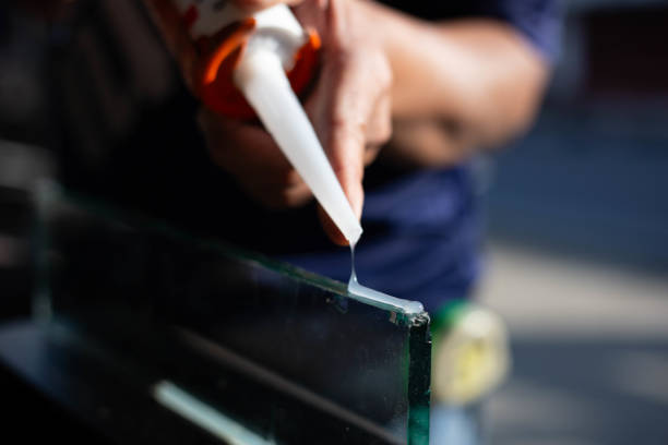 istock silicone adhesive with a glue gun 2202614442