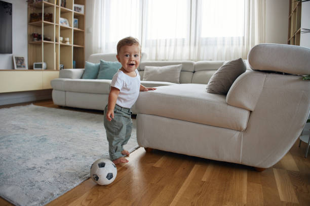 istock Beautiful, happy baby boy playing 2202615914
