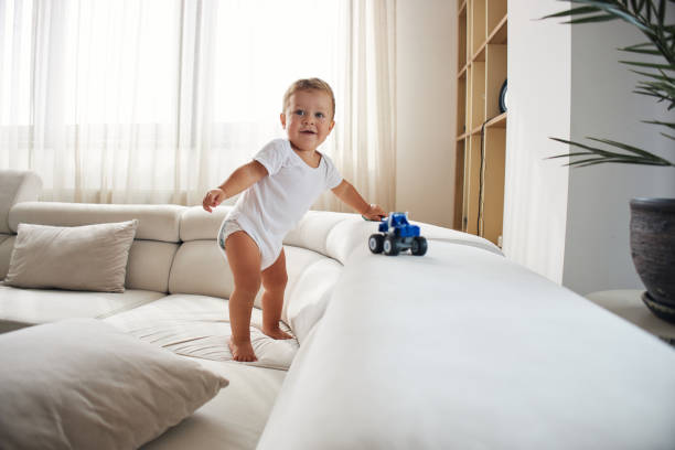Beautiful, happy baby boy playing stock photo
