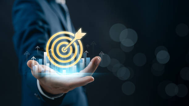 istock Business goal setting and success strategy. businessman with glowing target with with financial growth indicators, emphasizing leadership, data-driven decision making, and success. 2202619780