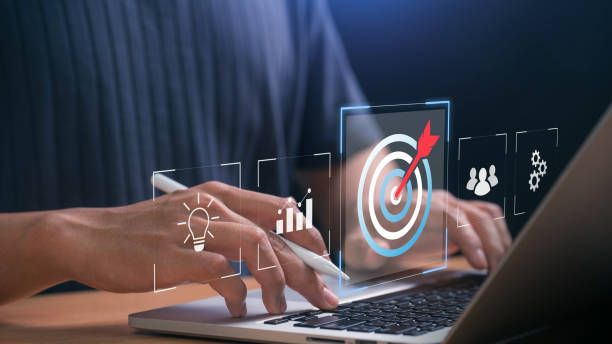 istock Business goal setting and digital strategy. professional working on a laptop with goal achievement icon, business analytics, teamwork, and innovation, symbolizing success and strategic planning. 2202619801