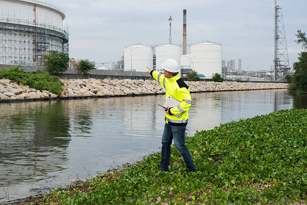 istock Engineers work with tablet in gas refineries and oil refinery plants to check production quality and safety of refineries. 2202628045