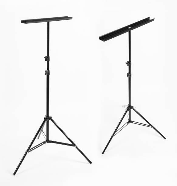 istock Black tripod with a metal comb. White background. 2202629933