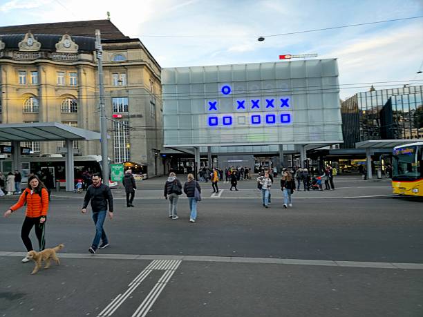 Germany, Berlin, Central Berlin, Friedrichstrasse station, May 15, 2024 -Small group of people walking at walkway at subway station