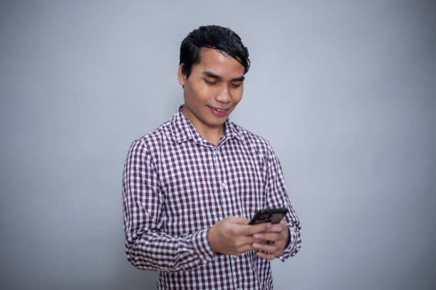 In studio with gray background