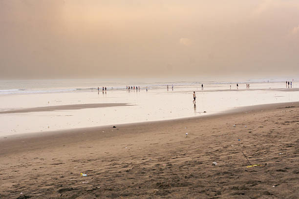 istock Beautiful beach scene with cloudy at sunset with people during vacation 2202631173