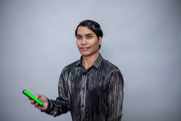 In studio with gray background