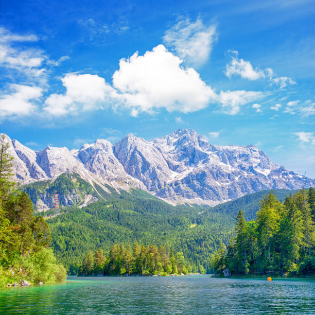View of the lake Eibsee with the Zugspitze mountain on background, Germany. Composite photo