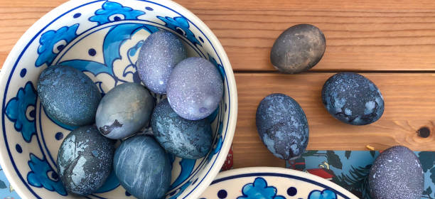istock Cosmic Easter eggs dyed in hibiscus tea for Orthodox Easter. Deep blue, purple, and marbled textures create a galaxy effect with natural dye for holiday Easter tradition 2202632747
