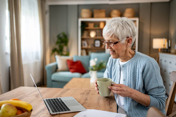 istock Senior woman working from home and having a video call 2202637566