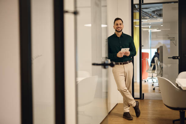 istock Businessman using tablet in modern coworking office space 2202637940