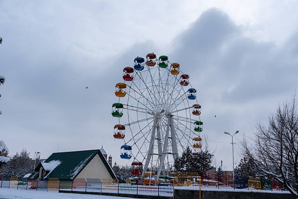 istock Ferris wheel in winter, carousel 2202637978