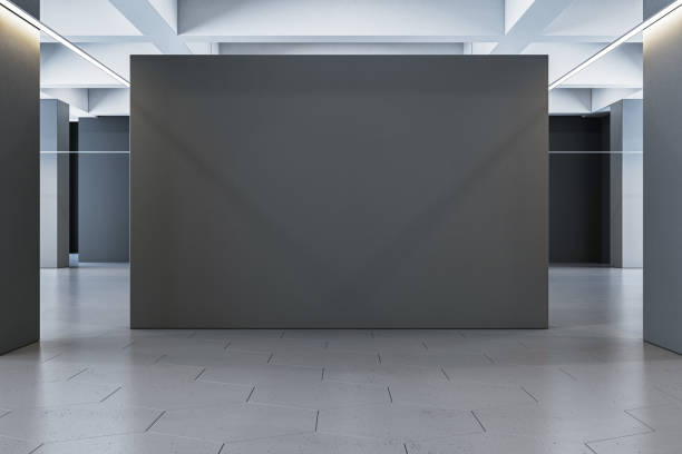 istock Modern gallery interior with blank dark grey exhibition walls. 3D Rendering 2202639548