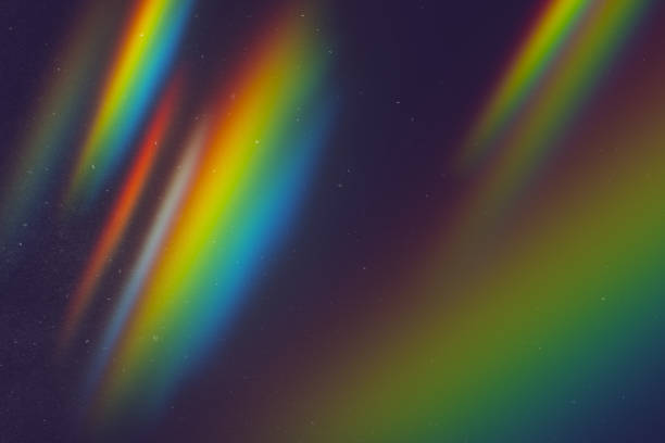 istock Abstract radiant light leak with rainbow spectrum effect on dark background. 3D Rendering 2202639602