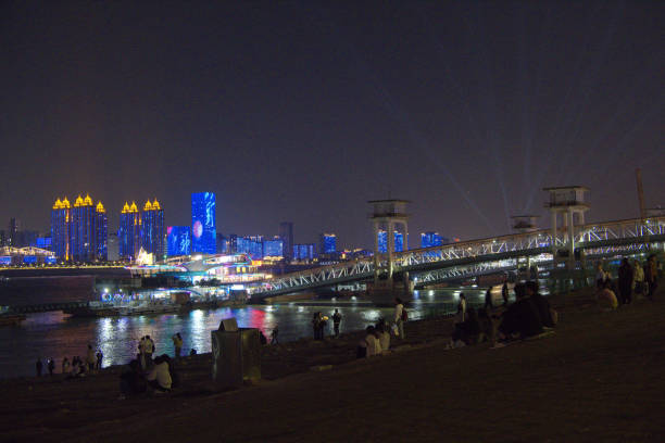Wuhan skyline by night on the Yangtze riverbank, Hubei province, China.