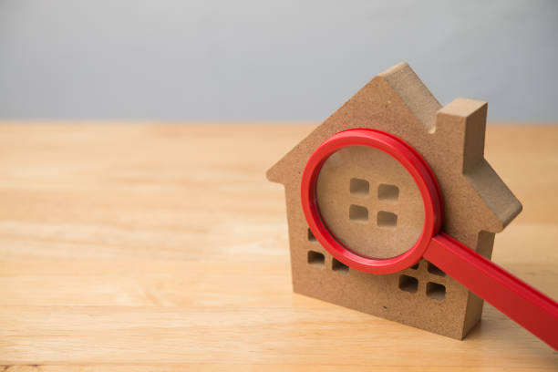 istock Magnifying glass lens zoom on house model copy space. 2202641730
