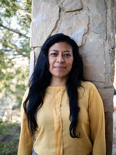 istock Latin woman in her thirties posing outdoors against a stone column 2202646914